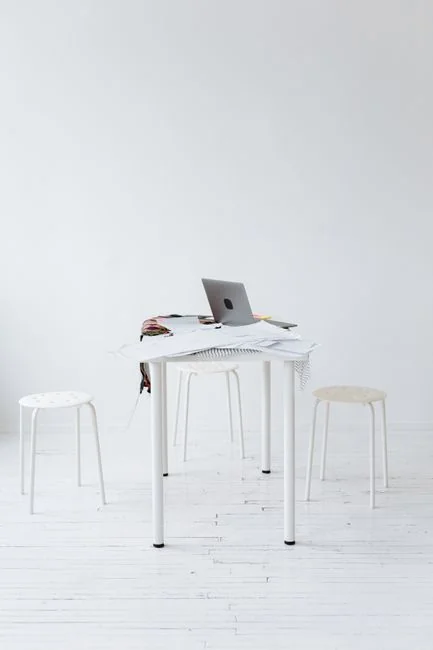 A contemporary workspace showcasing a laptop, tablet, and smartphones, ideal for tech and freelance use.